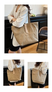 Détail d'un sac cabas en toile kaki avec broderie et grande bandoulière d'épaule