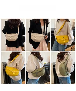 Detail of half-moon crossbody bags in beige, yellow, and green worn by a model