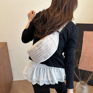 Floral plaid crossbody chest bag with adjustable strap shown from a back-view perspective