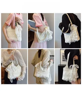 Multiple views of a large white lace bucket bag featuring a decorative bow and silk scarf