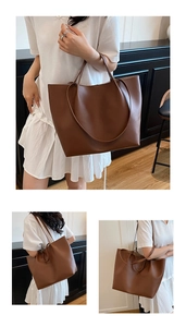 Detail view of large brown PU leather tote bag with long straps for commute and casual use