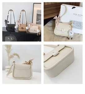 Detail view of small square crossbody bags in black and beige with silk scarf and doll