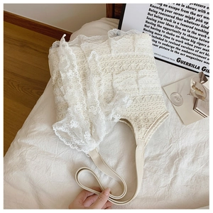 Close-up of white lace tote bag with delicate floral crochet and layered ruffles