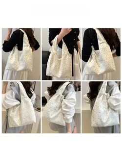 Detail shots of floral canvas tote bag featuring lace bow and large capacity design