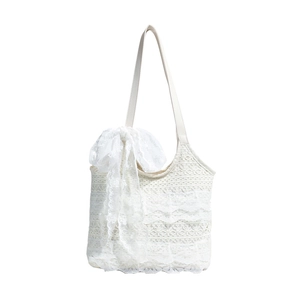 Chic white lace tote bag with crochet floral pattern and oversized decorative bow detail