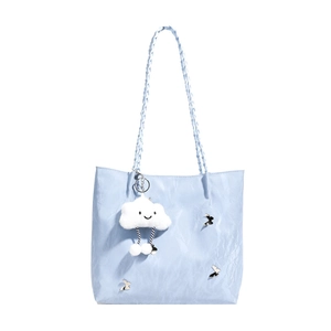 Light blue pleated tote bag with woven straps and silver butterfly metal charms