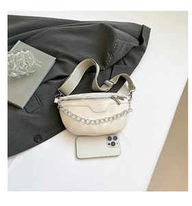 Top view of cream white leather waist bag with silver chain and adjustable wide strap