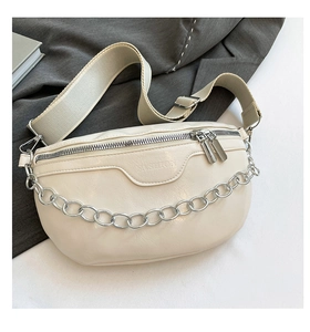Detail of off-white crescent waist bag with silver chain and wide shoulder strap