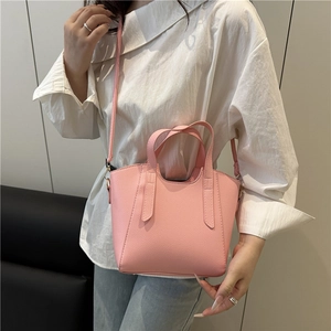 Pink lychee grain leather bucket bag for women with top handles and adjustable shoulder strap