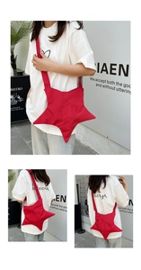 Detail of red star-shaped canvas crossbody bag with stitched pattern and red shoulder strap
