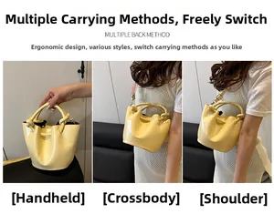 Three-way carry glossy pale yellow bucket bag with unique knotted handle and shoulder strap