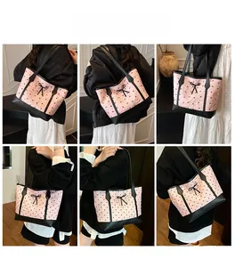 Detail of pink tote bag featuring black bow patterns and elegant leather straps
