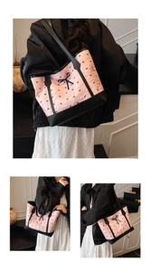 Close-up of pink quilted tote bag featuring black bow details and leather texture