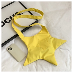 Detailed close-up of a star-shaped yellow canvas crossbody bag with smooth nylon texture
