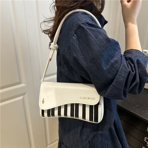 Fashionable piano key crossbody bag featuring musical notes and I LIKE MUSIC embroidery