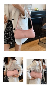 Detail of pink bow shoulder bag with metallic accent on polished faux leather material