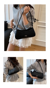 Detailed views of a black faux leather underarm bag featuring a silver bow buckle accent