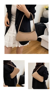 Detail of elegant crescent shoulder bag with metallic bow knot and smooth leather finish
