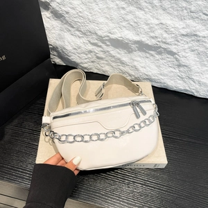Cream PU crossbody chest bag with silver chain and adjustable woven strap on main view
