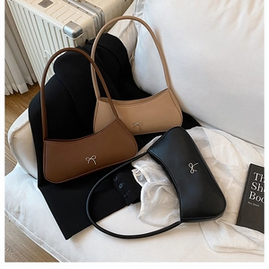 Minimalist faux leather hobo bags in black, brown, and beige with metal bow details