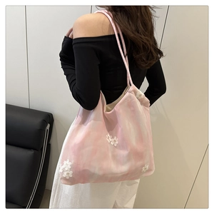 Detailed back view of pink tie-dye tote bag with 3D floral embroidery and shoulder strap