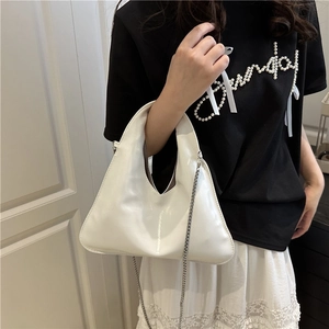 Chic white glossy triangle handbag with silver chain strap and top handle design