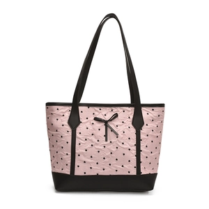 Pink heart print tote bag with black bow and leather straps on white background