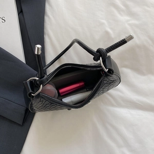 French style black woven crescent bag showing spacious interior for essentials