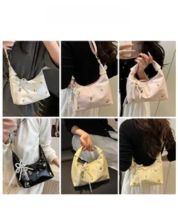 Detailed grid view of trendy leather crescent bags in four colors with floral studs