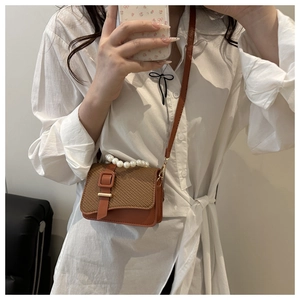 Brown small crossbody bag with woven texture, pearl handle and square buckle detail