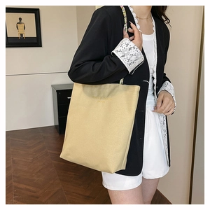 Fashionable beige tote bag with beaded strap and Opening Fashion print on shoulder