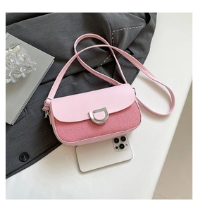 Detail of pink and red crossbody bag with silver D-buckle and smartphone size reference