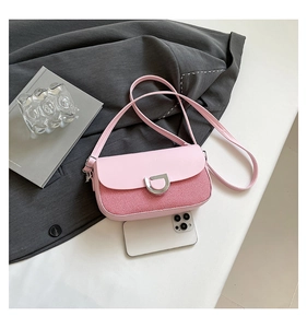 Detail of pink woven crossbody bag with silver D-ring buckle and phone for size comparison