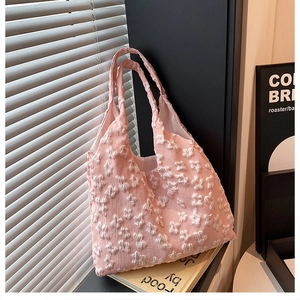 Close-up of pink lace floral texture and soft fabric on summer aesthetic tote bag