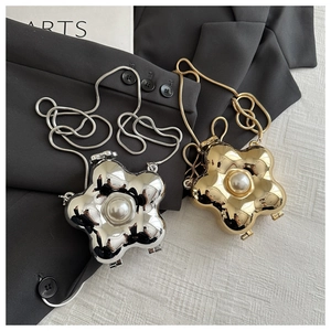 Detailed macro view of the acrylic flower petal evening bag with a central pearl and chain