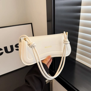 White minimalist leather shoulder bag with knot strap and gold XM & BAGS logo