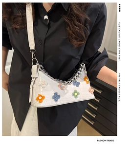 Chic white crocodile pattern shoulder bag with colorful floral patches and silver chain