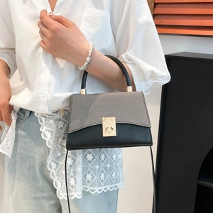 Chic two-tone gray and black contrast handbag with gold clasp for women's office fashion