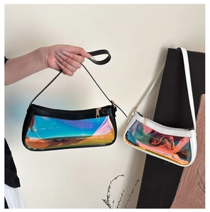 Detail view of clear iridescent shoulder bags in black and white with leather trim