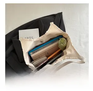 Spacious beige woven tote interior showing storage for tablet, wallet, and umbrella