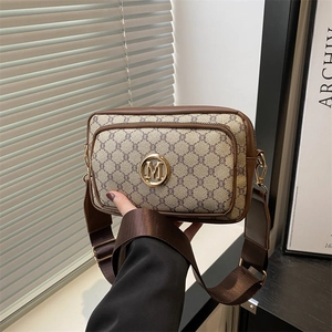 Retro monogram crossbody bag with wide shoulder strap and gold metallic M hardware