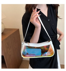 Detail view of white underarm ita bag with iridescent transparent window and metal zipper