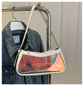 Detail of iridescent TPU makeup bag with white leather trim and sturdy metal zipper