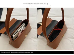 Détail de l'intérieur du sac porté épaule en similicuir brun et sa capacité