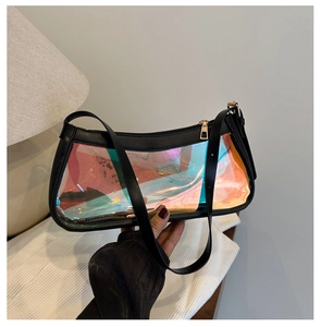 Detailed shot of holographic PVC shoulder bag featuring black leather trim and gold zipper