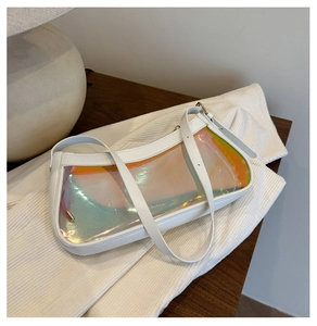Close-up of holographic transparent panel on white shoulder bag with metallic buckle detail