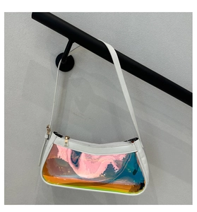 Detail of white leather shoulder bag featuring a rainbow holographic transparent PVC panel