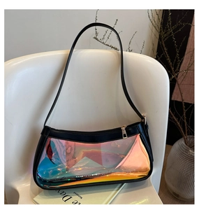 Macro detail of holographic laser PVC panel on black leather shoulder bag with gold zipper