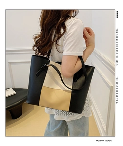Detailed view of tricolor patchwork tote bag showing large capacity and leather texture