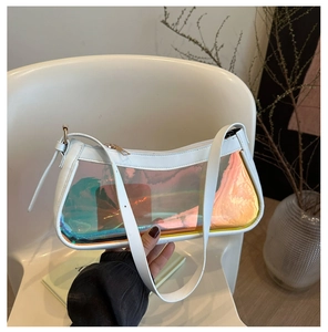 Detail of white shoulder bag featuring a holographic clear panel and metallic zipper